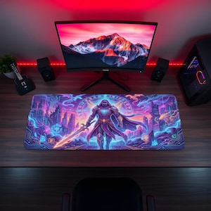 May include: A large rectangular gaming mouse pad featuring a fantasy warrior design. The pad has a vibrant color scheme of purple, blue, and orange, with a futuristic city and a hooded figure holding a glowing sword. The pad is on a wooden desk.