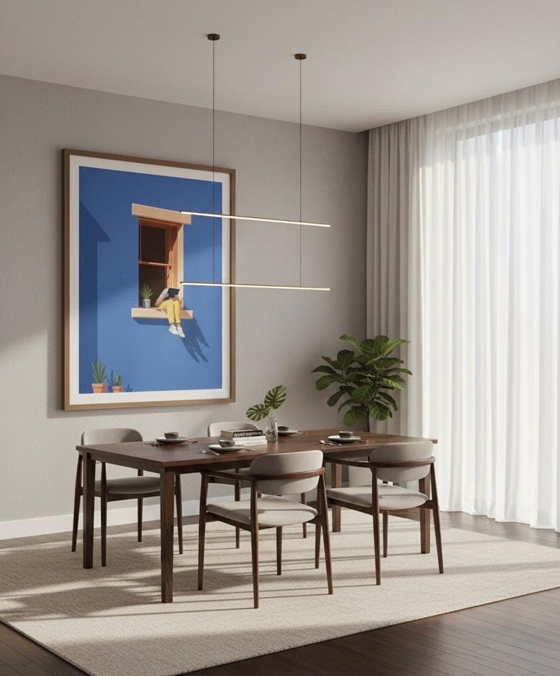 May include: A dining room scene featuring a wooden table and four chairs. A large framed artwork with a blue background hangs on the wall. Two linear pendant lights hang above the table. A rug and curtains complete the room.