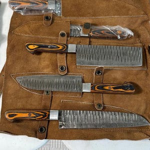 May include: A handmade wooden sign with the text "Welcome to our home" in a handwritten style. The sign is painted white with black lettering and a distressed finish, perfect for home decor.