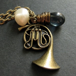 Music Instrument Necklace. French Horn Necklace with Deep Blue Teardrop and Pearl. Handmade Jewellery. image 1