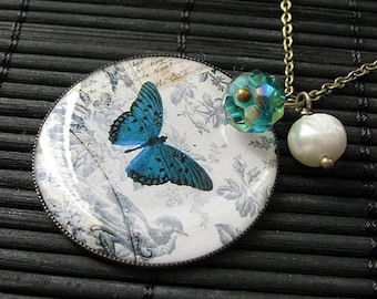 Teal Butterfly Charm Necklace in Bronze with Teal Crystal Charm and Genuine Pearl. Handmade Jewelry.