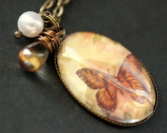 Auburn Butterfly Necklace. Orange Butterfly Pendant with Glass Teardrop and Pearl. Oval Charm Necklace. Handmade Jewellery.