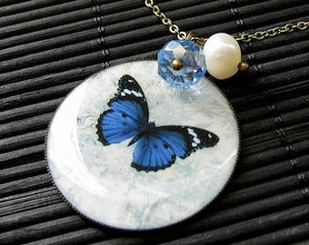 Morpho Butterfly Necklace in Bronze with Blue Crystal Charm and Fresh Water Pearl. Handmade Jewelry.