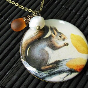Gray Squirrel Charm Necklace in Bronze with Frosted Honey Glass Wire Wrapped Teardrop and Pearl. Handmade Jewelry.