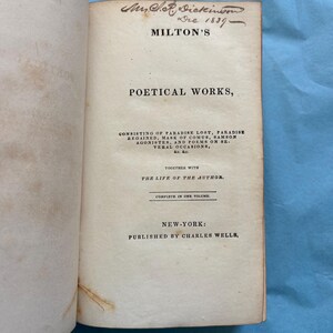 May include: Open book with the title page of "Milton's Poetical Works." The page includes the author's name, the date 1837, and the publisher's information. The book is open to the title page.