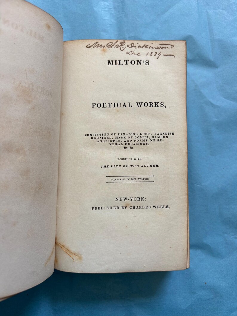May include: Open book with the title page of "Milton's Poetical Works." The page includes the author's name, the date 1837, and the publisher's information. The book is open to the title page.