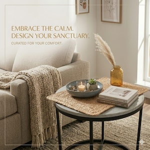 May include: A cozy living room scene with a neutral-toned sofa, a chunky knit throw, and a round side table. The table holds a decorative bowl with a candle and succulent, books, and a textured vase with dried grass. Text reads: EMBRACE THE CALM. DESIGN YOUR SANCTUARY.