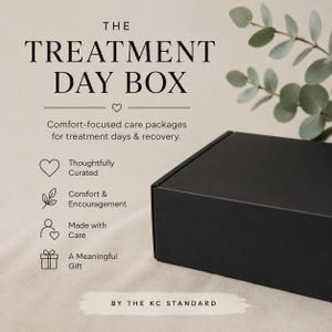 May include: A black box with the text "THE TREATMENT DAY BOX" and the tagline "Comfort-focused care packages for treatment days & recovery." The box is accompanied by icons and text: "Thoughtfully Curated", "Comfort & Encouragement", "Made with Care", and "A Meaningful Gift".