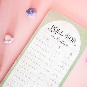 May include: A light green and white "Roll for Initiative" notepad with a floral design, perfect for tabletop role-playing games. Includes spaces for name, AC, and HP. Two multi-colored dice are visible on a pink background.