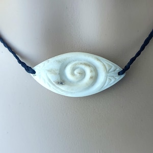 Hand carved bone pendant~ New Zealand Koru eye design to bring clarity and insight