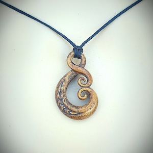 Hand carved bone pendant~ Maori Love symbol