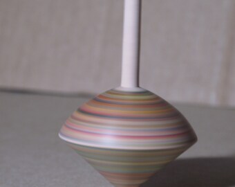 Onion shaped spinning top, hand turned, with rainbow stripes