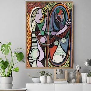 May include: A framed abstract painting featuring a woman looking into a mirror. The artwork uses a vibrant color palette of red, yellow, blue, and green. The woman's form is stylized with geometric shapes and lines.