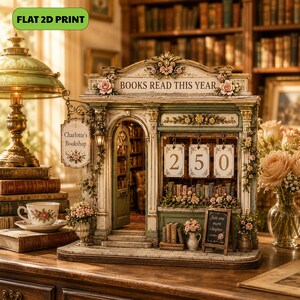 May include: A decorative miniature bookshop model titled "BOOKS READ THIS YEAR" with a hanging sign reading "Charlotte's Bookshop". The structure features a green and cream facade, floral accents, and three hanging cards displaying the number 250.
