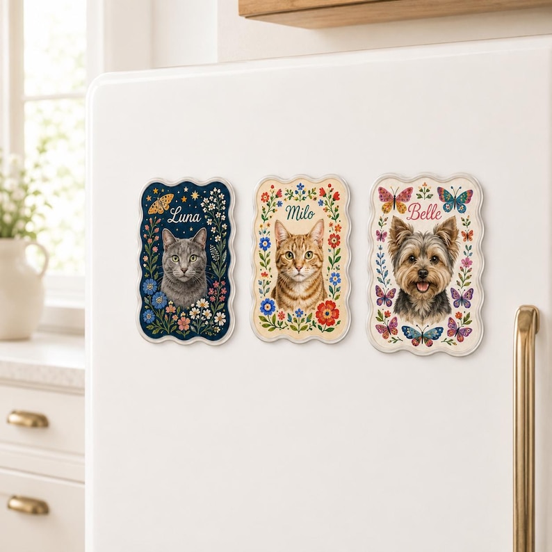 May include: Three rectangular magnets with scalloped edges featuring portraits of pets. The first shows a gray cat named Luna, the second an orange tabby cat named Milo, and the third a Yorkshire Terrier named Belle, all surrounded by floral motifs.