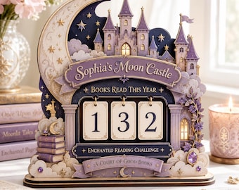 May include: A decorative wooden book tracker featuring a castle and crescent moon design. It displays the text 'Sophia's Moon Castle', 'Books Read This Year', 'Enchanted Reading Challenge', and 'A Court of Good Books' with flip cards showing 132.