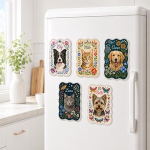 May include: Five rectangular magnets with scalloped edges featuring portraits of pets named Lily, Milo, Oscar, Luna, and Belle. Each magnet displays a colorful floral and butterfly border surrounding the animal's face and their name in script.
