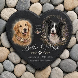 May include: A heart-shaped black slate memorial plaque featuring portraits of a golden retriever and a border collie. The text reads Together Forever, Bella & Max, 2012-2025, 2013-2026, and Always Loved, Never Forgotten, with floral wreaths and a paw print.