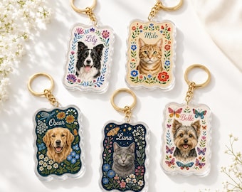 May include: Five rectangular acrylic keychains with scalloped edges, each featuring a portrait of a pet—a border collie, tabby cat, golden retriever, gray cat, and yorkshire terrier—surrounded by floral illustrations and names Lily, Milo, Oscar, Luna, and Belle.