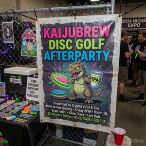 May include: A banner for the KaijuBrew Disc Golf Afterparty, featuring a cartoon dinosaur holding a disc and a beer. The banner has the event name in bright colors and event details.