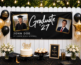 May include: A black graduation banner featuring the text Graduate '27, John Doe, and St. John High School, with two photos of a graduate. The display includes a white cake with a Class of 2027 topper, cupcakes, a framed sign, and black and gold balloons.
