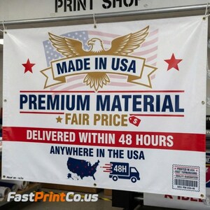 May include: A white banner with the text "MADE IN USA" above "PREMIUM MATERIAL" and "FAIR PRICE". The banner features an eagle, stars, and the American flag. The banner also states "DELIVERED WITHIN 48 HOURS ANYWHERE IN THE USA".