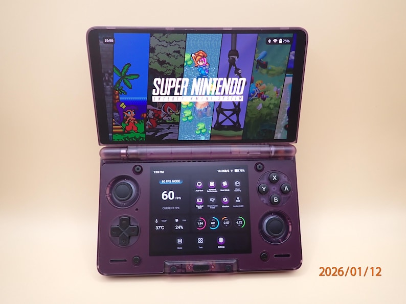 May include: A purple handheld gaming console with a screen displaying a Super Nintendo game. The console has a second screen below with performance metrics. The date 2026/01/12 is visible on the right side.