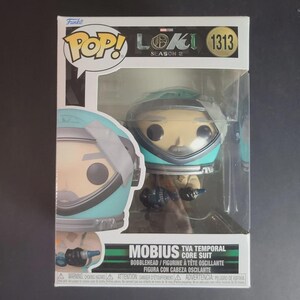 May include: Funko Pop! figure of Mobius in a TVA Temporal Core Suit from Loki Season 2. The figure has a bobblehead design and is in a display box. The figure is wearing a teal and silver space suit.
