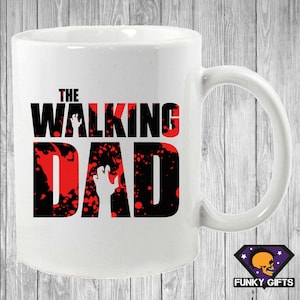 May include: White ceramic mug with a black and red graphic that says "The Walking Dad" with a zombie hand silhouette.