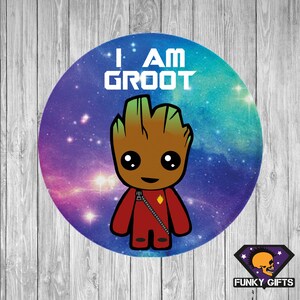 May include: A round sticker featuring a galaxy background and a cartoon image of Groot from Guardians of the Galaxy. The text "I AM GROOT" is written in white letters on the sticker.