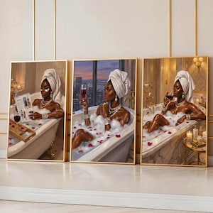 May include: Set of three framed art prints depicting a woman in a bathtub. Each print shows a woman with a towel on her head, enjoying a bath with bubbles, rose petals, and a glass of wine. The artwork has a luxurious theme.