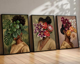 May include: Three framed wall art prints featuring portraits of individuals with faces obscured by botanical arrangements. The first shows green monstera leaves, the second displays lilies and anthuriums, and the third features orchids and dahlias.