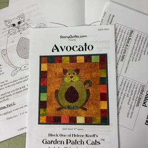 May include: A quilt pattern titled "Avocato" featuring a cat-shaped avocado design. The pattern is part of the "Garden Patch Cats" series and includes a recipe for chicken and avocado salad. The block size is 18 inches square.