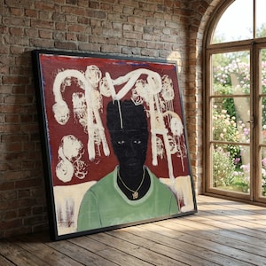 May include: Large framed artwork featuring a portrait of a person with black skin, wearing a green shirt and a gold necklace. The background is red with white abstract shapes. The artwork is displayed in a room with a brick wall and a window.