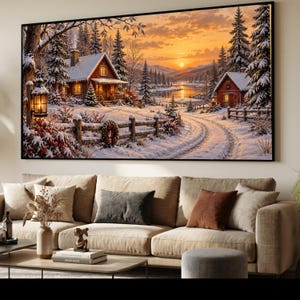 May include: A rectangular wall art print depicting a winter landscape with two red cabins, snow-covered pine trees, and a wooden fence. The scene features a sunset sky with orange and yellow hues, a frozen river, and a glowing lantern on a post.