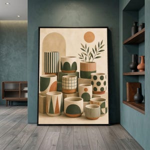 May include: A framed wall art print featuring a collection of cylindrical ceramic pots in various sizes, decorated with geometric patterns in shades of green, terracotta, and cream, arranged on stacked blocks with a sun and arch background.