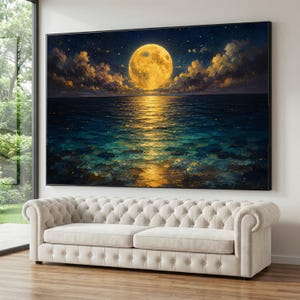 May include: A large rectangular wall art print featuring a full golden moon centered above a dark blue ocean at night. The moon casts a bright yellow reflection across the rippling water surface, surrounded by dark clouds and a starry sky.
