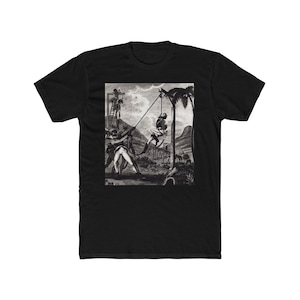 May include: Black t-shirt with a monochrome historical illustration. The image shows figures, a gallows, and a palm tree. The artwork is detailed and looks like a vintage print, possibly from a historical event.