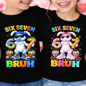 May include: Black t-shirts with colorful graphics. One shirt features a bunny wearing a cap and sunglasses, holding a donut-shaped 6 and a 7. The other shirt has a bunny with a bow and sunglasses, holding a donut-shaped 6 and a 7. The word "BRUH" is below.