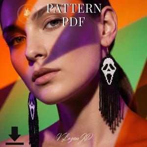 May include: A pair of long, dangling beaded earrings featuring a white ghost face mask design on a black background, with long black fringe tassels hanging from the bottom. The text PATTERN PDF is visible at the top, and a download icon is at the bottom.