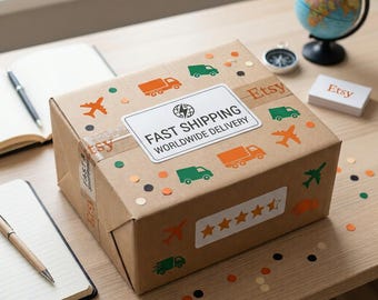 May include: A brown cardboard shipping box decorated with orange and green icons of lorries and aeroplanes. A white label on top reads FAST SHIPPING WORLDWIDE DELIVERY. A second white label on the side displays five orange star icons.