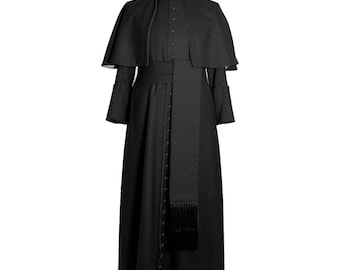 May include: A black clerical cassock with a matching cape and sash. The long-sleeved robe features a high collar and a row of buttons down the front. The sash is wrapped around the waist and hangs down with a fringed end. The outfit is displayed on a mannequin.