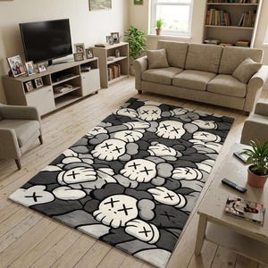 May include: A rectangular area rug featuring a repeating pattern of stylized white skull-like heads with crossed-out eyes and gloved hands, set against a dark gray and black background of overlapping organic shapes and shadows.