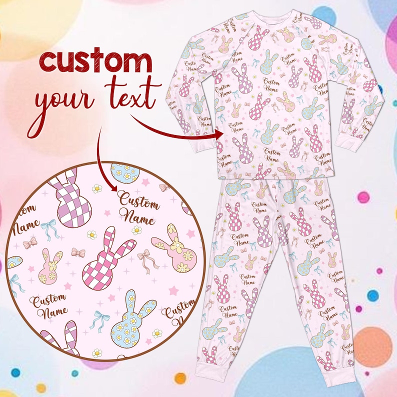 May include: A light pink pajama set featuring a pattern of pastel bunnies, bows, and the text "Custom Name." The long-sleeved top and trousers are designed for comfort. The words "custom your text" are in the upper left corner.