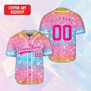 May include: A short-sleeve baseball jersey featuring a pink, blue, and yellow glitter gradient pattern with white trim. The front displays the text Team Name and the number 00 in pink. The back shows the text Your Name and the number 00 in pink.
