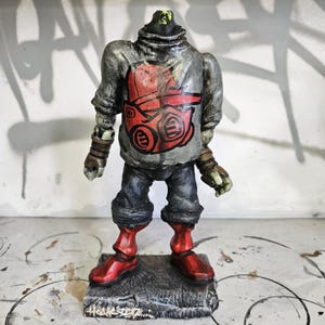 Graffitifigur Leksaksdel Staty Skulptur av Hoakser