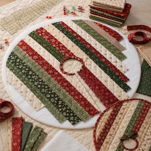 May include: A circular quilted tree skirt featuring alternating diagonal fabric strips in red, dark green, and cream with gold snowflake and floral patterns. The design includes a central circular cutout and a straight slit for placement around a tree base.