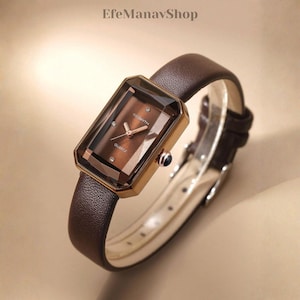 Vintage brunt läderklocka, rektangulärt fasetterat glas, elegant kvartsarmbandsur