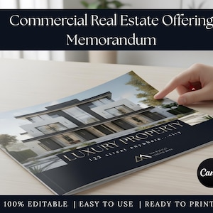 May include: A brochure titled "Commercial Real Estate Offering Memorandum" with a modern building image. The brochure features the text "LUXURY PROPERTY" and "100% EDITABLE | EASY TO USE | READY TO PRINT". A hand points to the brochure on a light wood surface.
