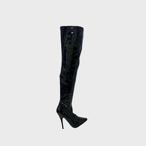 May include: A single black, over-the-knee boot with a pointed toe and stiletto heel. The boot is made of a shiny, patent leather-like material. The heel is approximately 10 cm high.